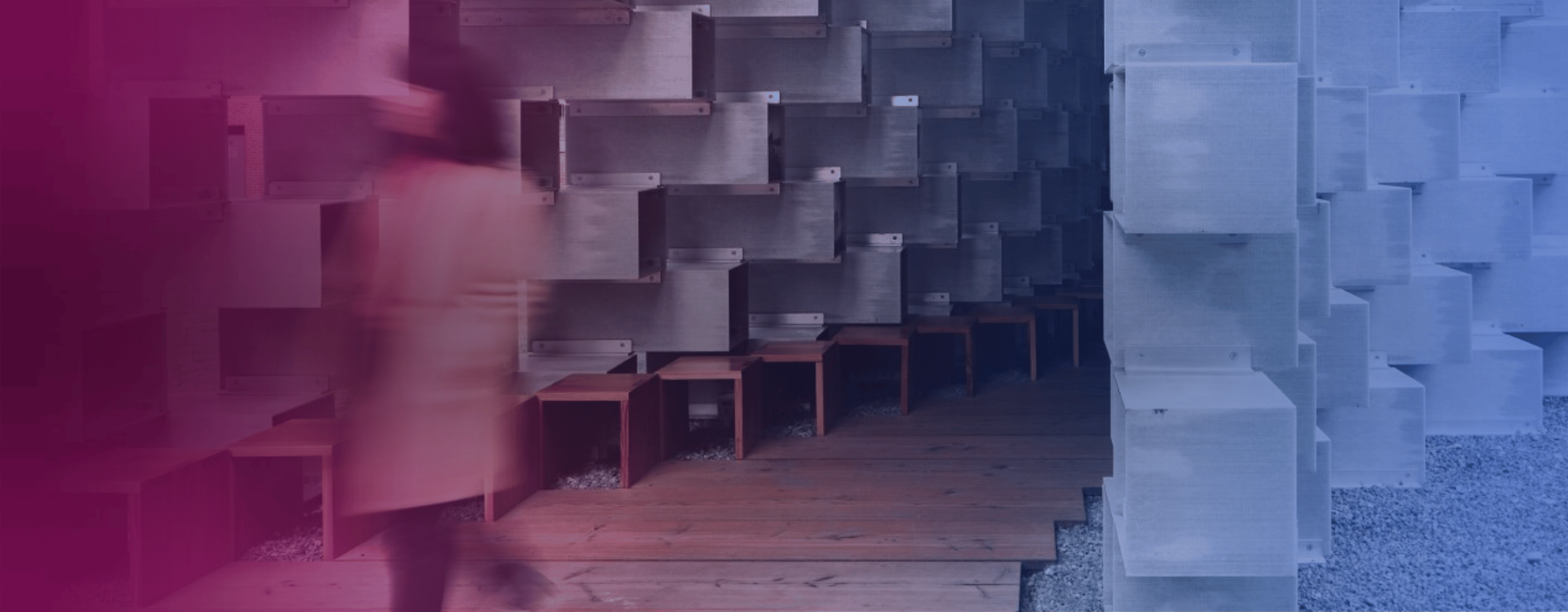 A stock image of a person walking past a building