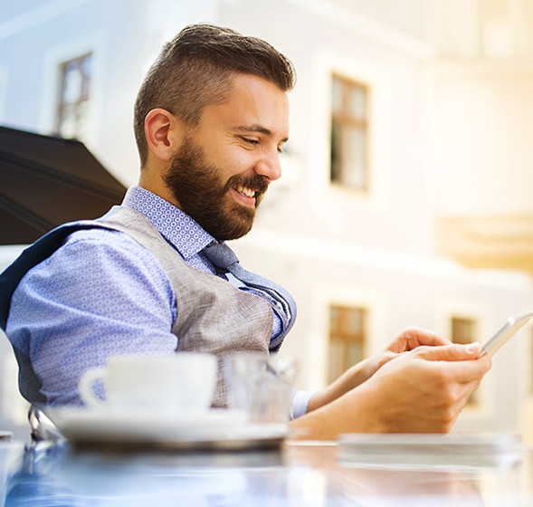 Man reading a newsletter on mobile